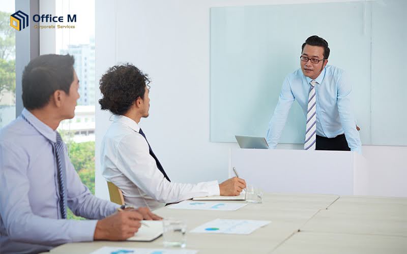 Nominee director conducting a business meeting in Singapore.