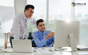 Office M consultants discussing business registration strategy.