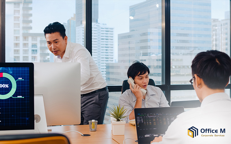 Busy office environment with corporate services support.