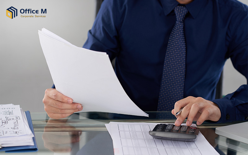 Office M accountant calculating SME tax planning