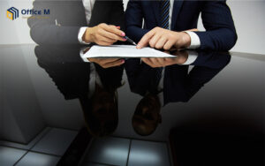 Business partners signing a legal compliance contract in Singapore